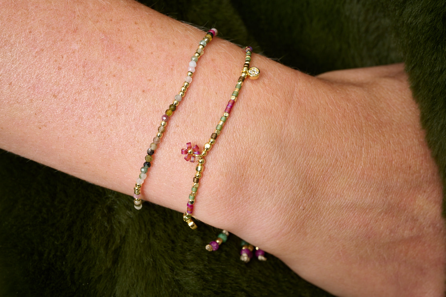 Rania Red & Green Gold Friendship Bracelet styled in a vibrant boho stack with summery tones and golden layers.