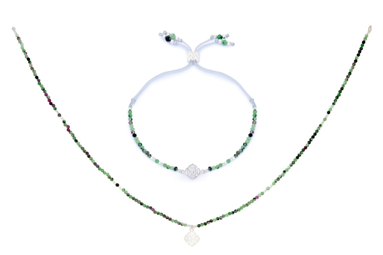 Ruby Zoisite Silver Root Chakra Necklace and Bracelet Set featuring rich green and ruby-speckled beads, silver-plated accents, and a Root Chakra charm symbolising grounding and stability.