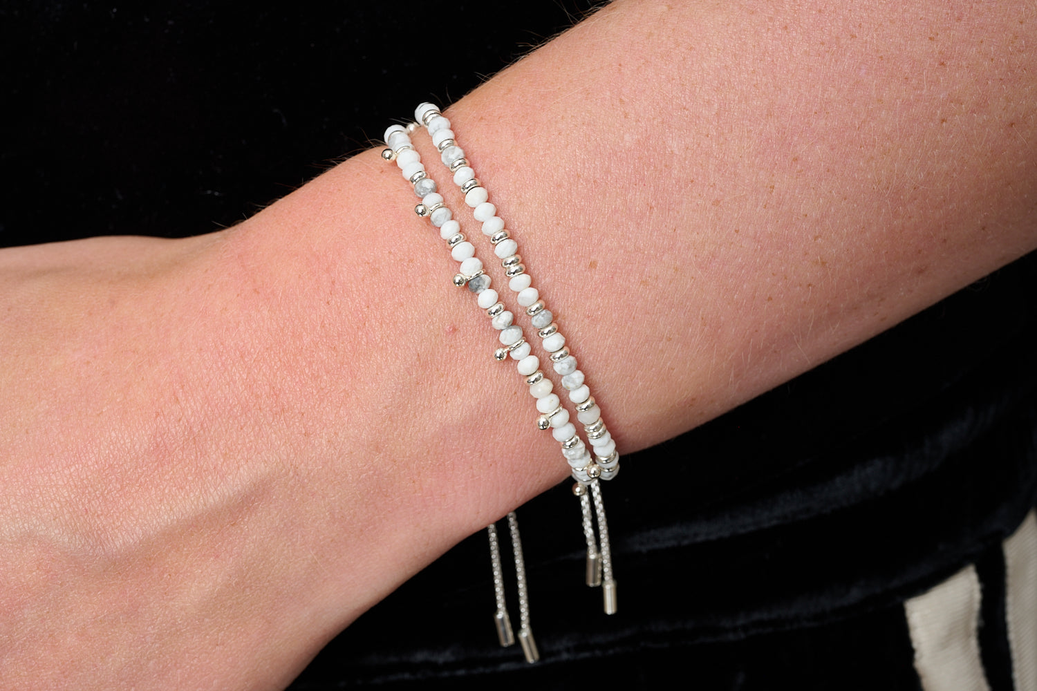 Serenity White Howlite & Silver Bracelet Stack styled on wrist with layered Boho Betty silver and white gemstone bracelets