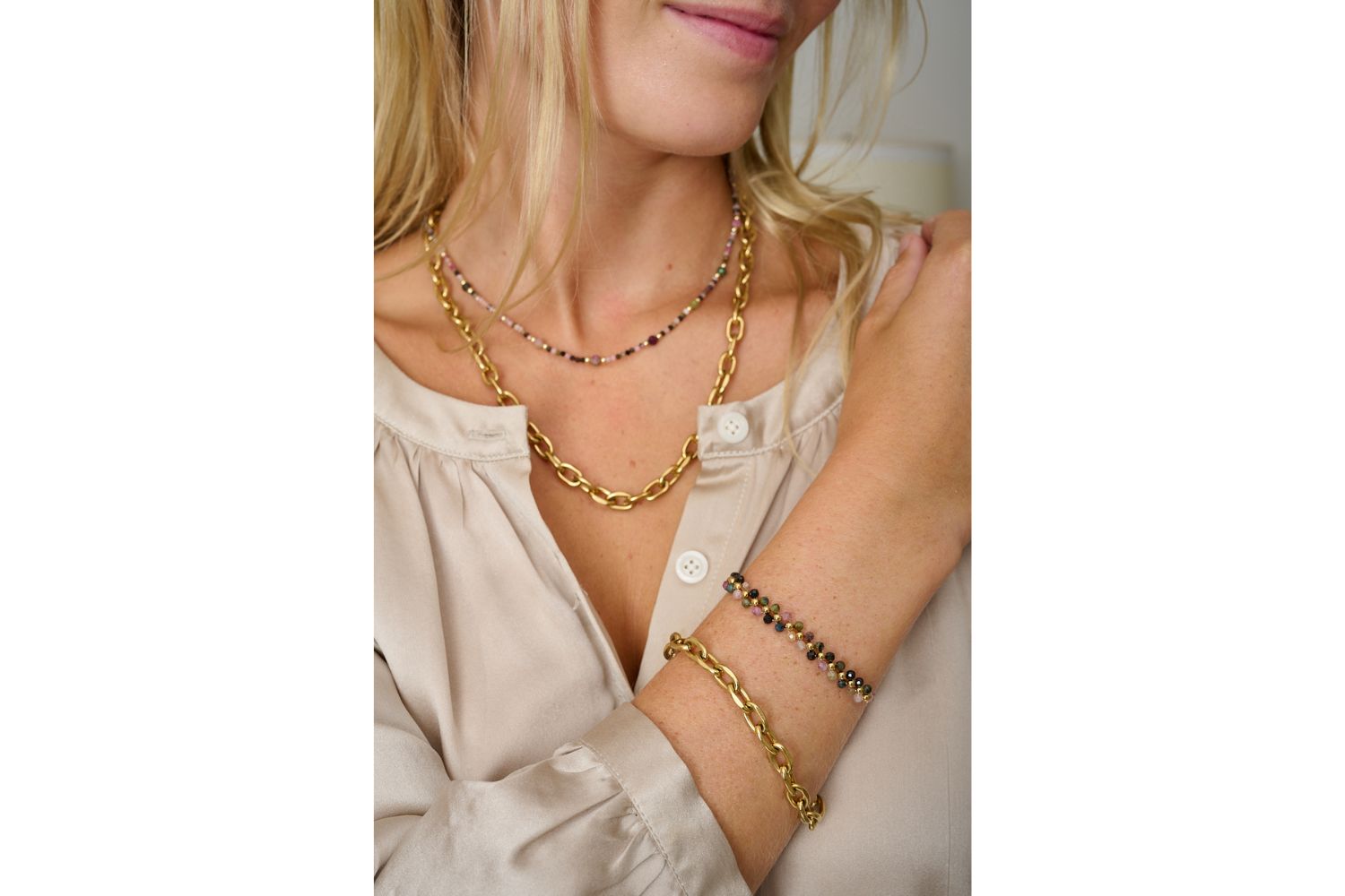 Tanna Tourmaline & Gold Bracelet Stack featured on wrist, a mix of gold and berry tones