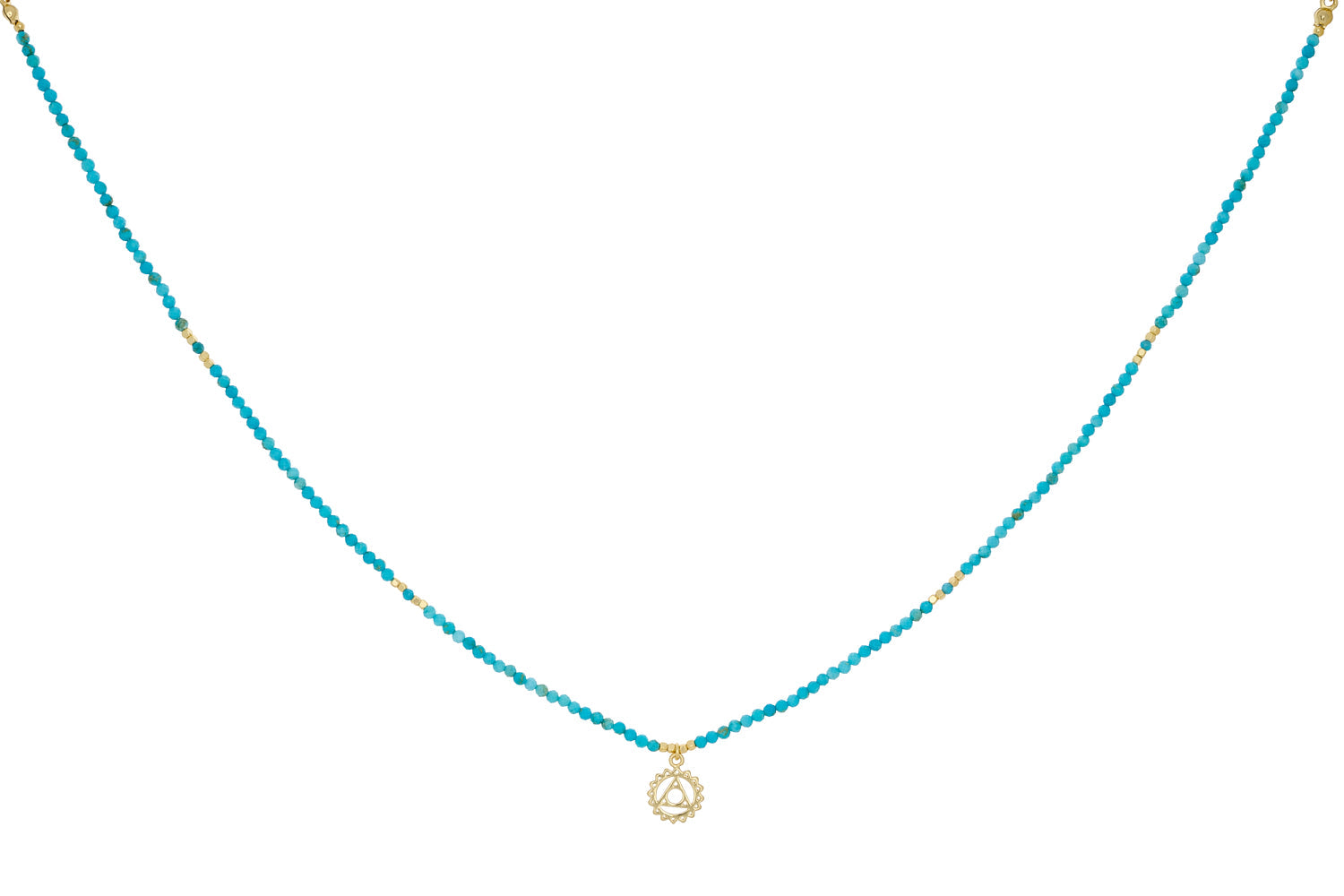 Turquoise Howlite & Apatite Gold Throat Chakra Necklace featuring turquoise howlite, apatite beads, and a gold-plated chakra charm with an adjustable chain.