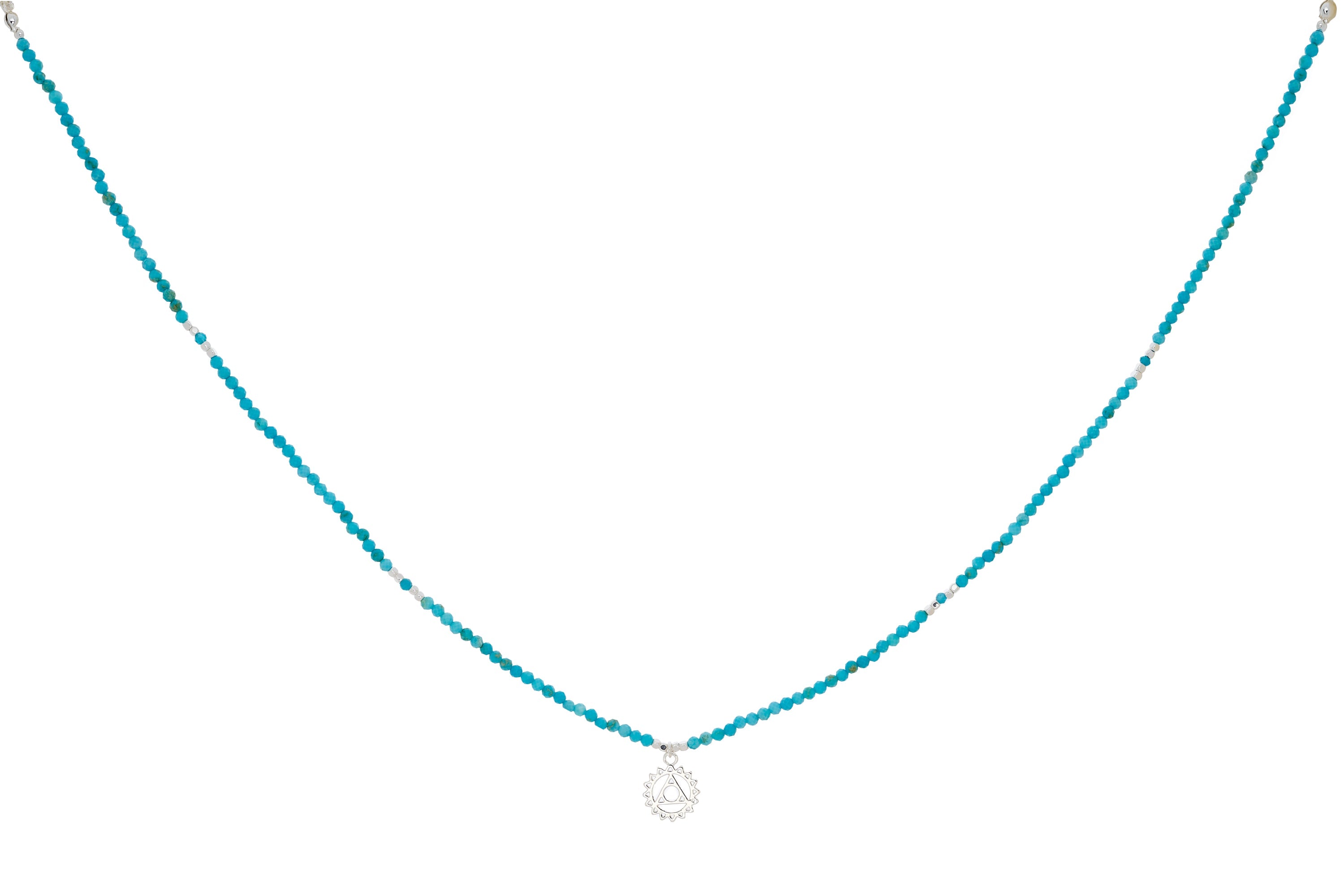 Turquoise Howlite, Apatite & Silver Throat Chakra Necklace featuring calming blue gemstone beads, a sterling silver-plated chakra charm, and an adjustable chain for effortless styling.