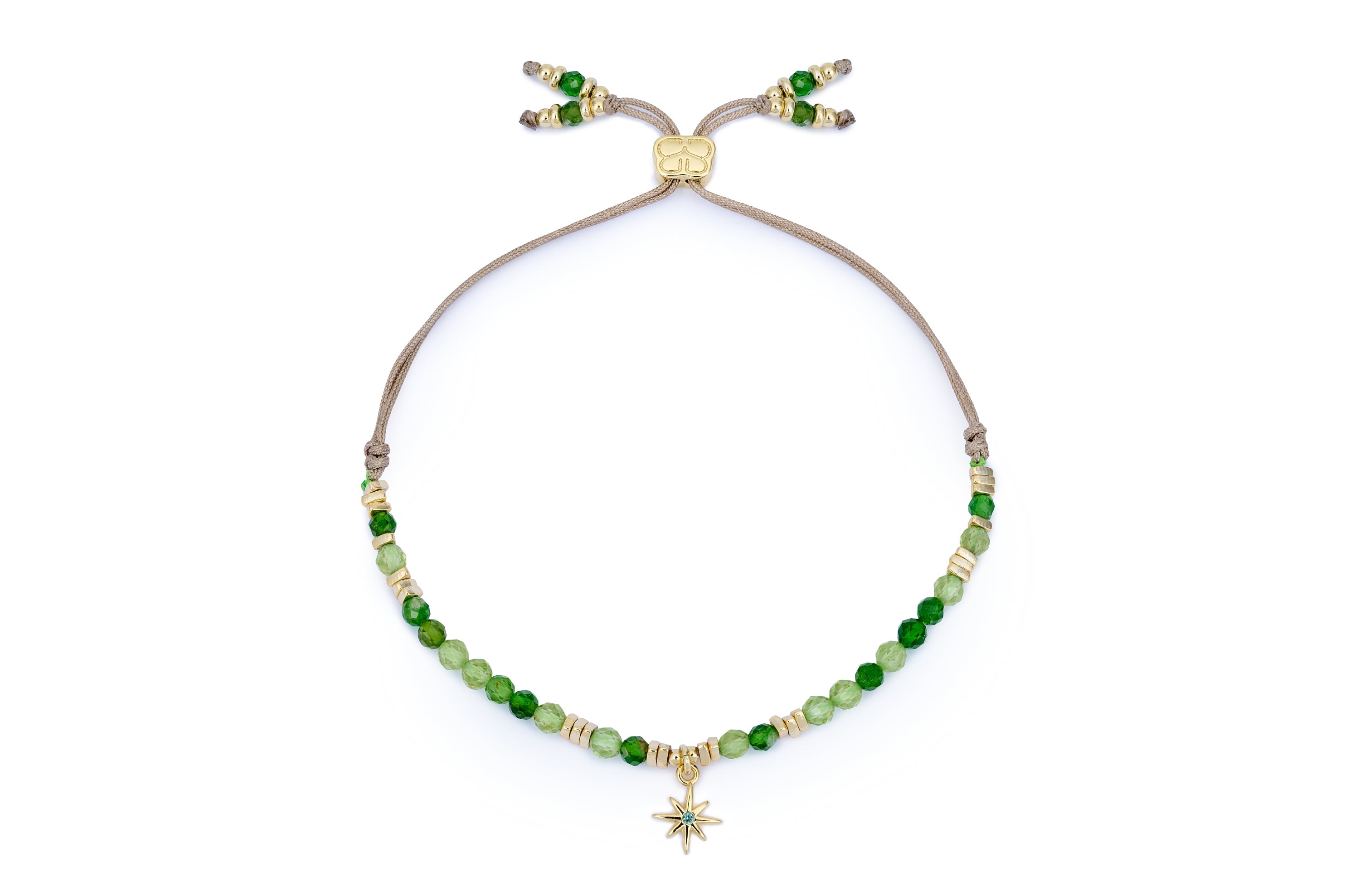 Una Peridot & Gold Star Charm Slider Bracelet featuring faceted Peridot gemstones, a delicate gold star charm, and 12k gold-plated accents, with an adjustable thread slider fastening.