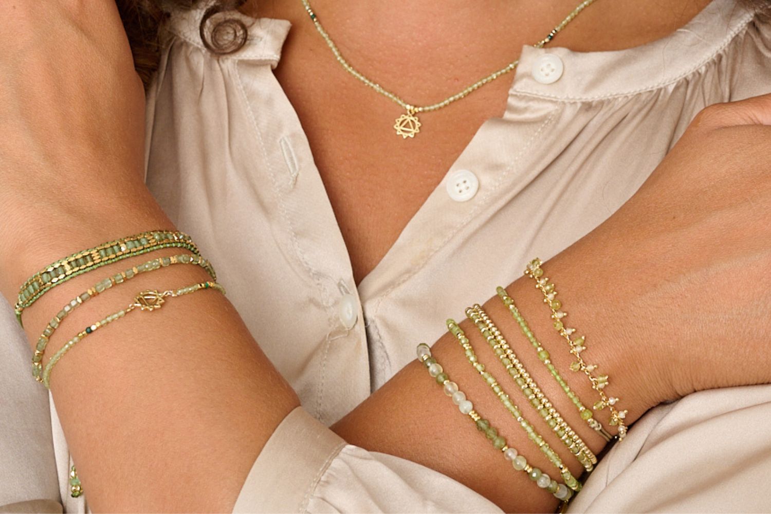 Valentina Green Apatite Gold Bracelet styled on the wrist, showcasing natural green apatite gemstones and waterproof gold PVD details designed for everyday wear and effortless layering.