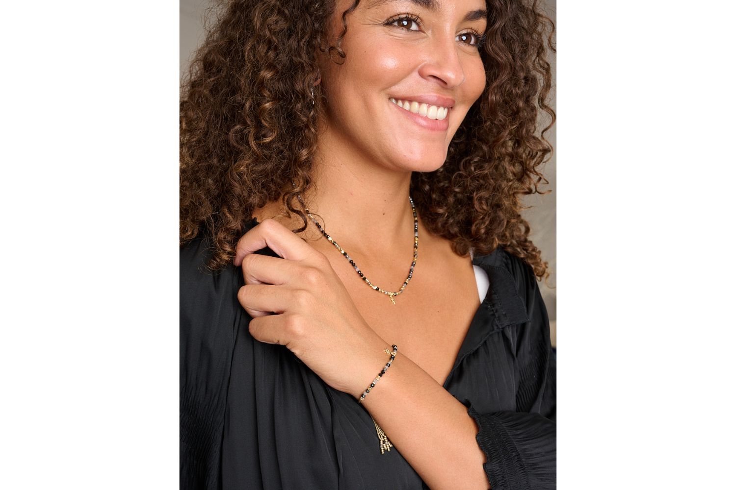 Yolanda & Una Black Rutilated Quartz Gold Jewellery Set styled with black blouse featuring necklace and bracelet