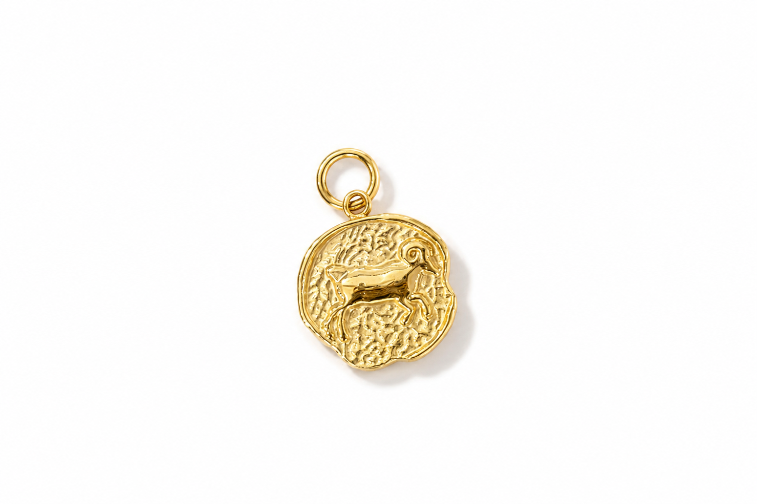 Zaya Aries Gold Waterproof Zodiac Charm featuring a textured coin-inspired design with a raised Aries symbol in waterproof 14k Gold PVD-coated stainless steel.