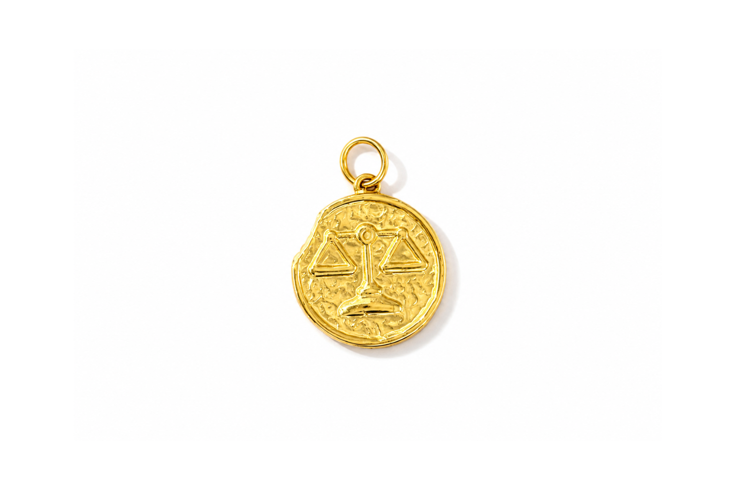 Zaya Libra Gold Waterproof Zodiac Charm featuring a textured coin-inspired design with a raised Libra symbol in waterproof 14k Gold PVD-coated stainless steel.