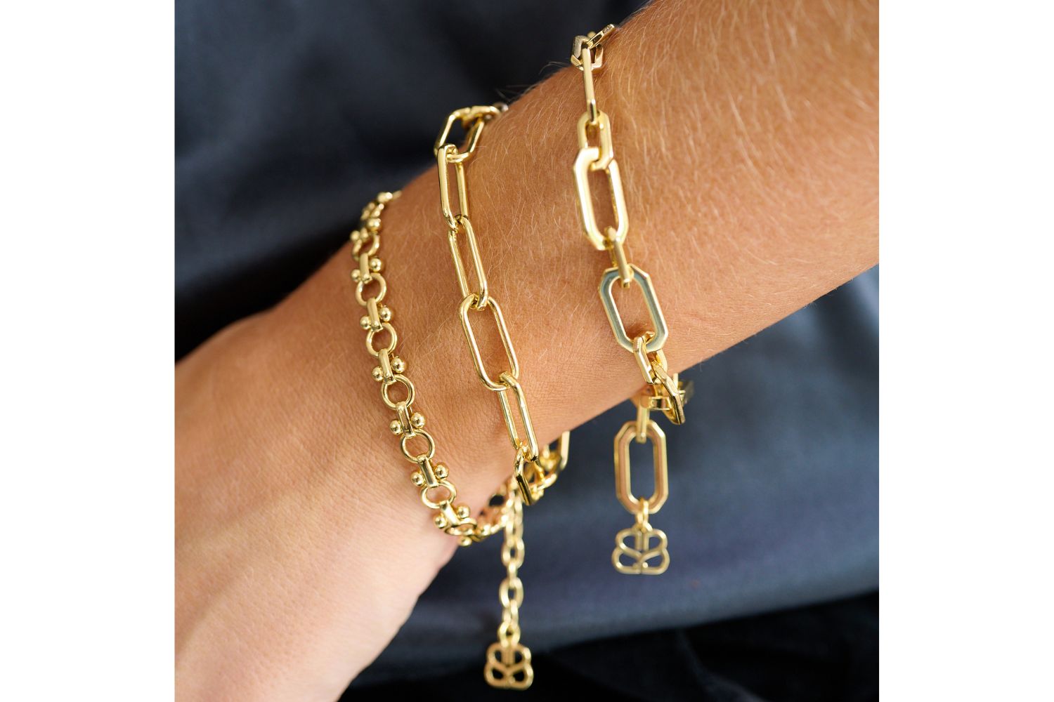 Crisos Gold Chain Bracelet styled with a chic outfit, showcasing its bold geometric links and polished gold finish for a modern statement.