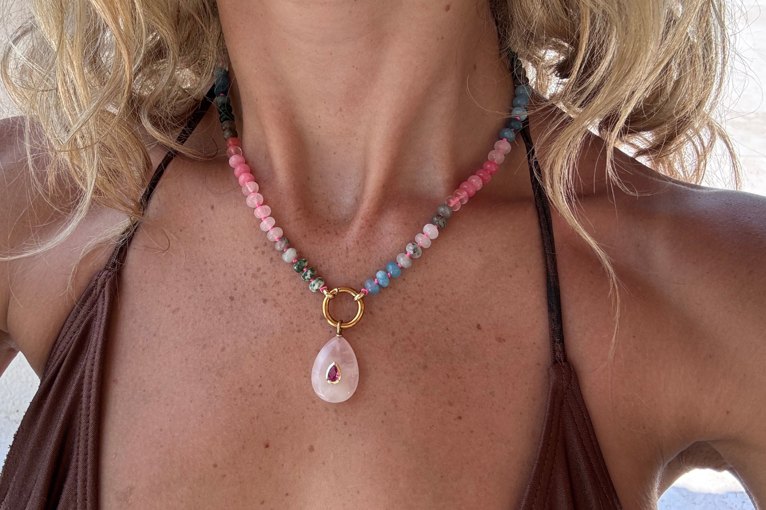 Amala Pink & Blue Gold Fleur Rose Quartz Teardrop Charm Necklace featuring jade, rose quartz and labradorite gemstone beads finished with a carved rose quartz teardrop pendant in waterproof 14k gold PVD.