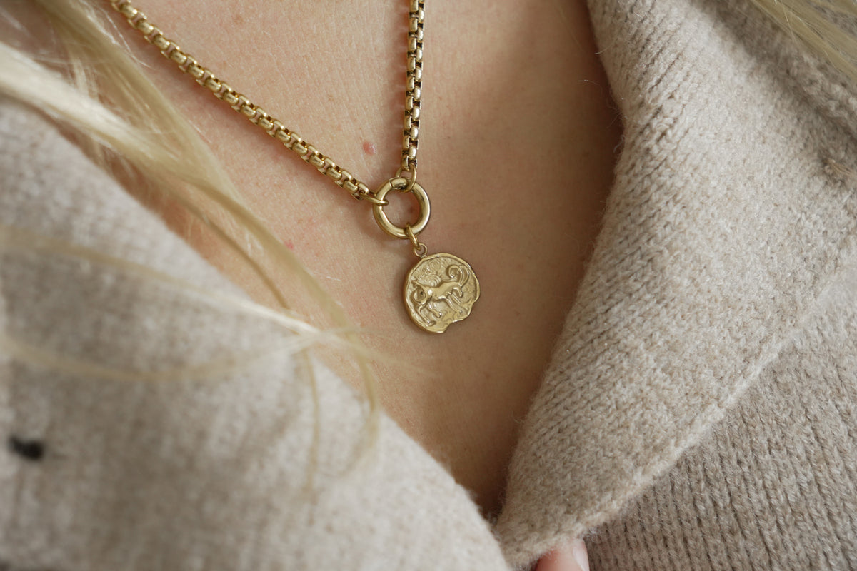 Zaya Capricorn Gold Zodiac Charm by Boho Betty – a waterproof gold Capricorn coin charm, styled on a gold chain necklace