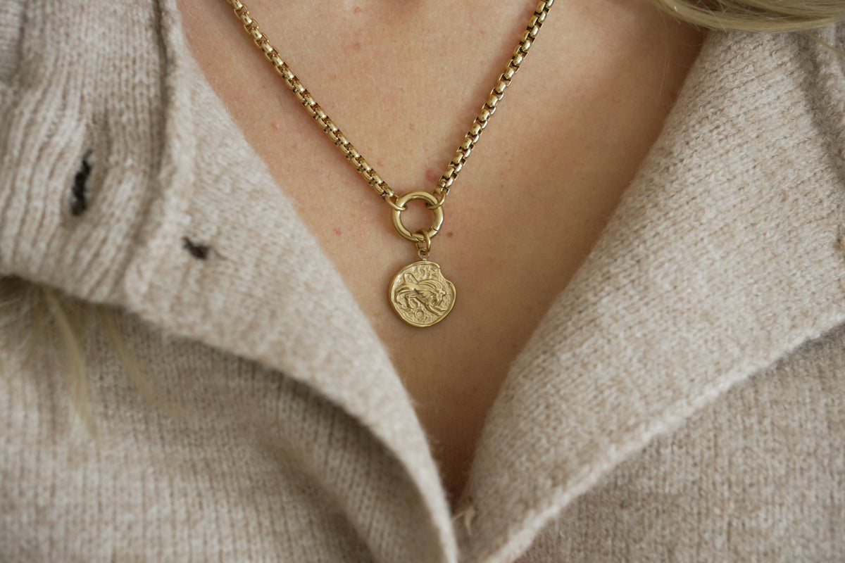 Zaya Leo Gold Zodiac Charm by Boho Betty – a waterproof gold Leo coin charm, styled on a gold chain necklace