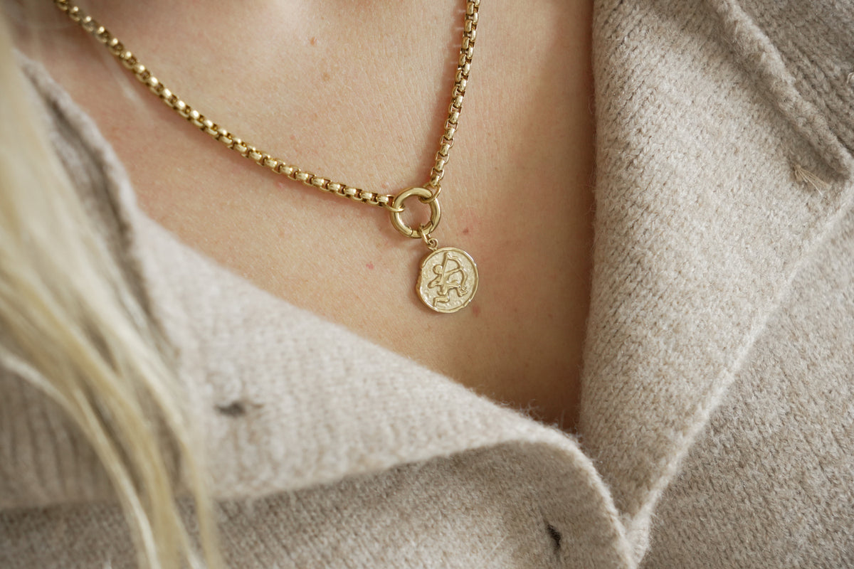 Zaya Sagittarius Gold Zodiac Charm by Boho Betty – a waterproof gold Sagittarius coin charm, styled on a gold chain necklace