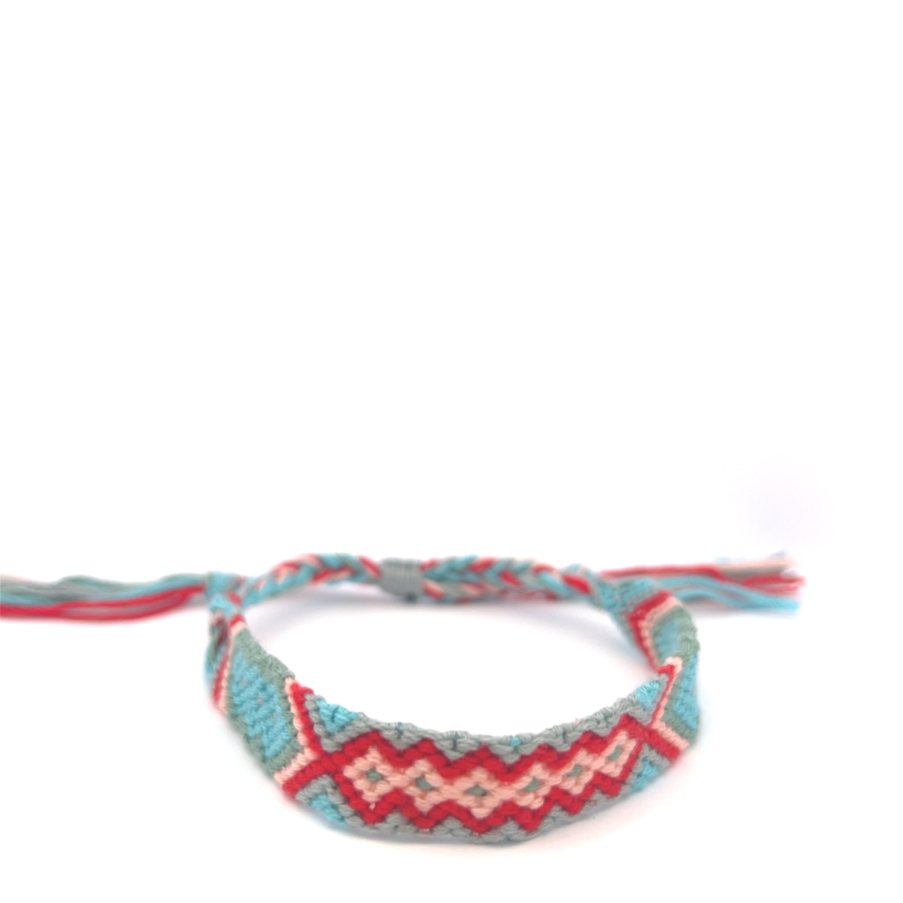 Woven bracelet with a geometric pattern on a white background #color_red
