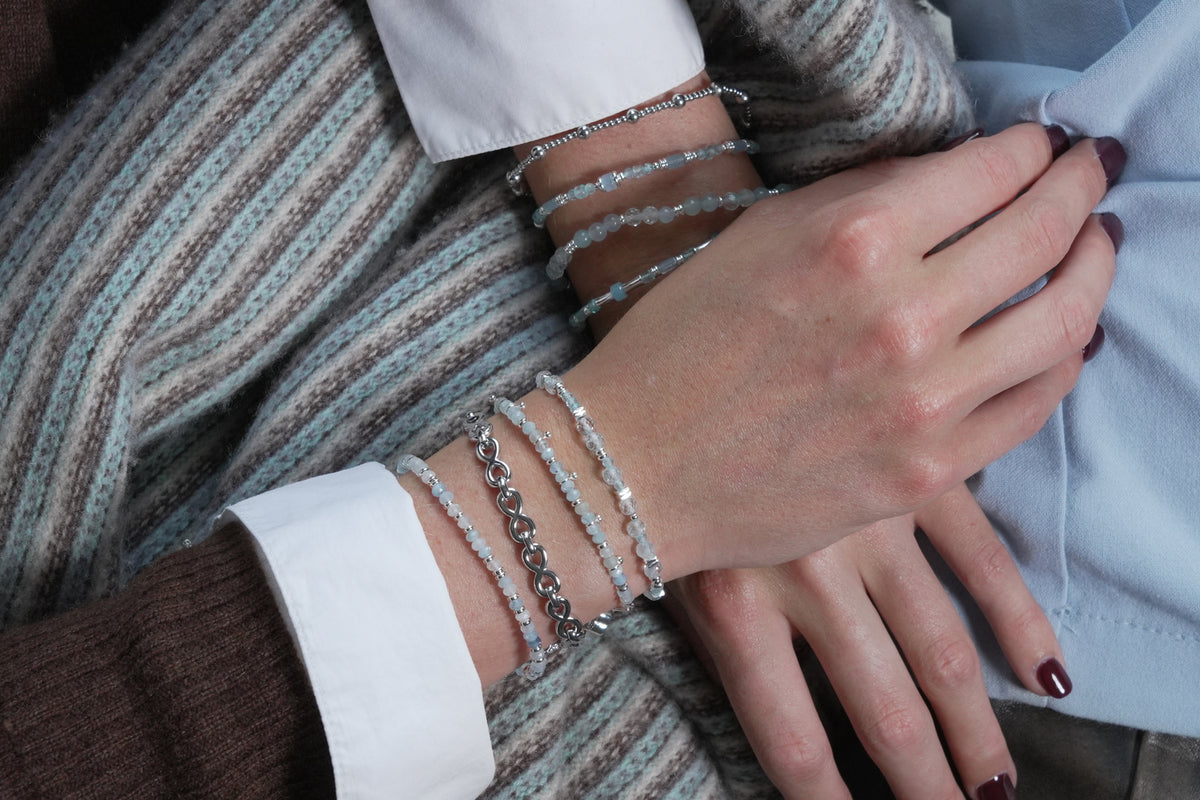 Octave silver infinity link bracelet by Boho Betty – styled in a stack, a stackable silver infinity link bracelet