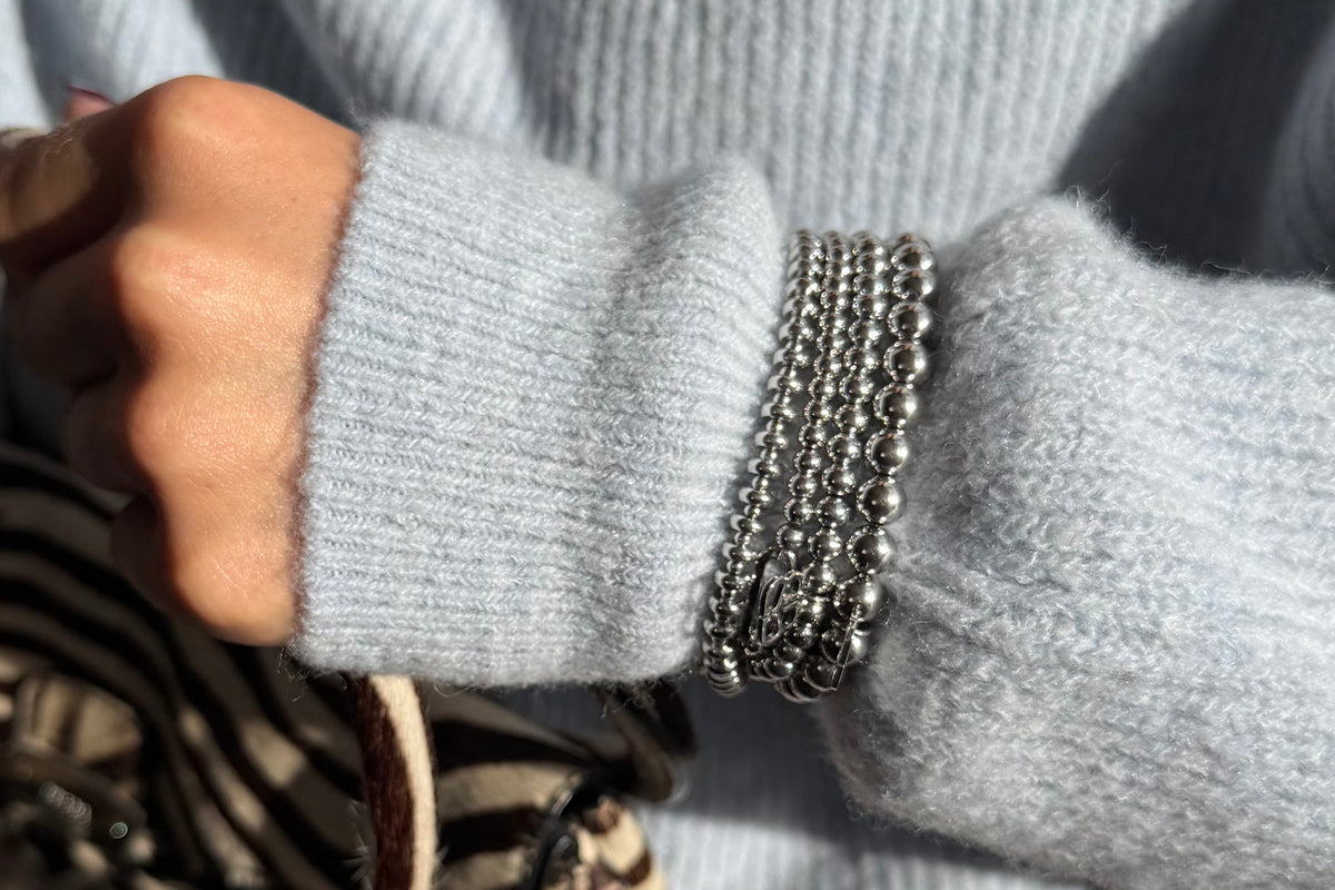 Lissette silver bead bracelet by Boho Betty – styled in a stack, a stackable silver beaded stretch bracelet for everyday wear