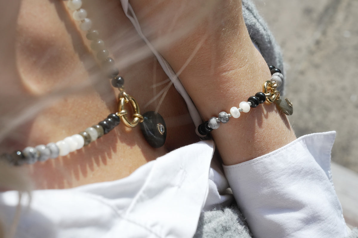 Amala black mix and Fleur labradorite necklace by Boho Betty – a gold labradorite beaded charm carrier necklace