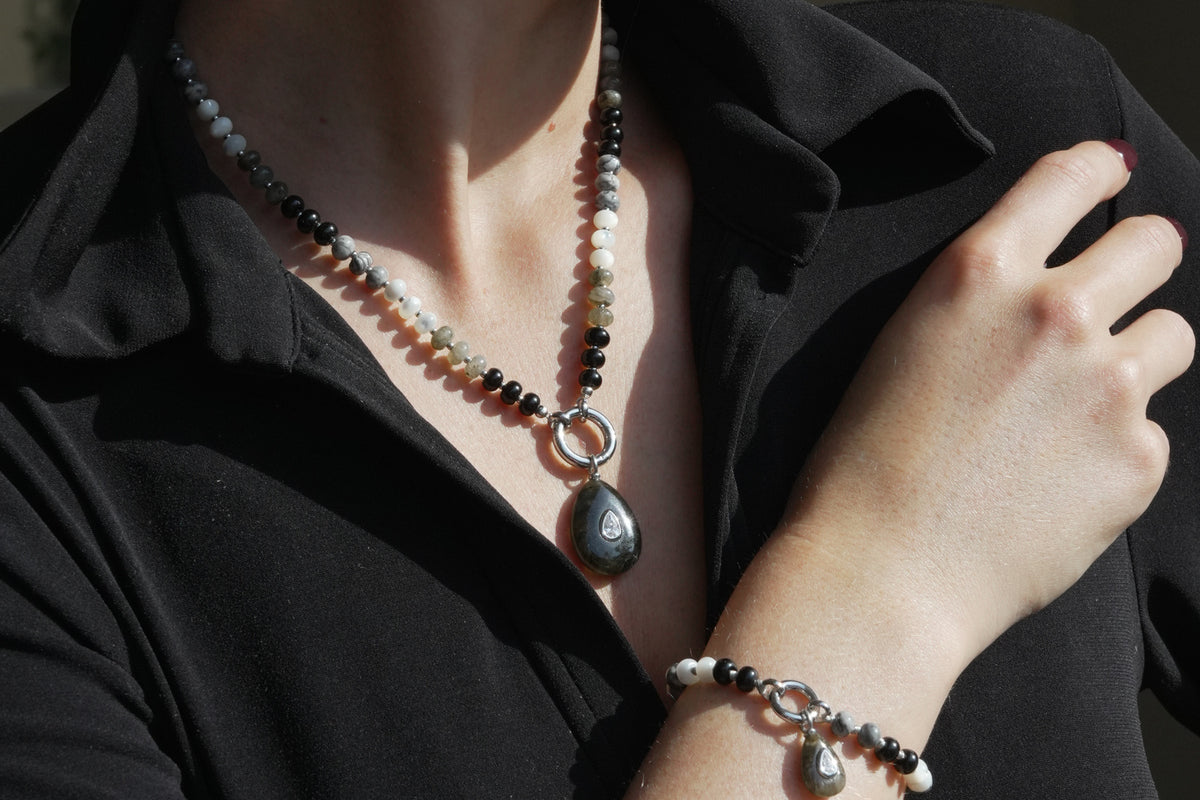 Amala black mix and labradorite charm necklace by Boho Betty – a white gold labradorite beaded charm carrier necklace