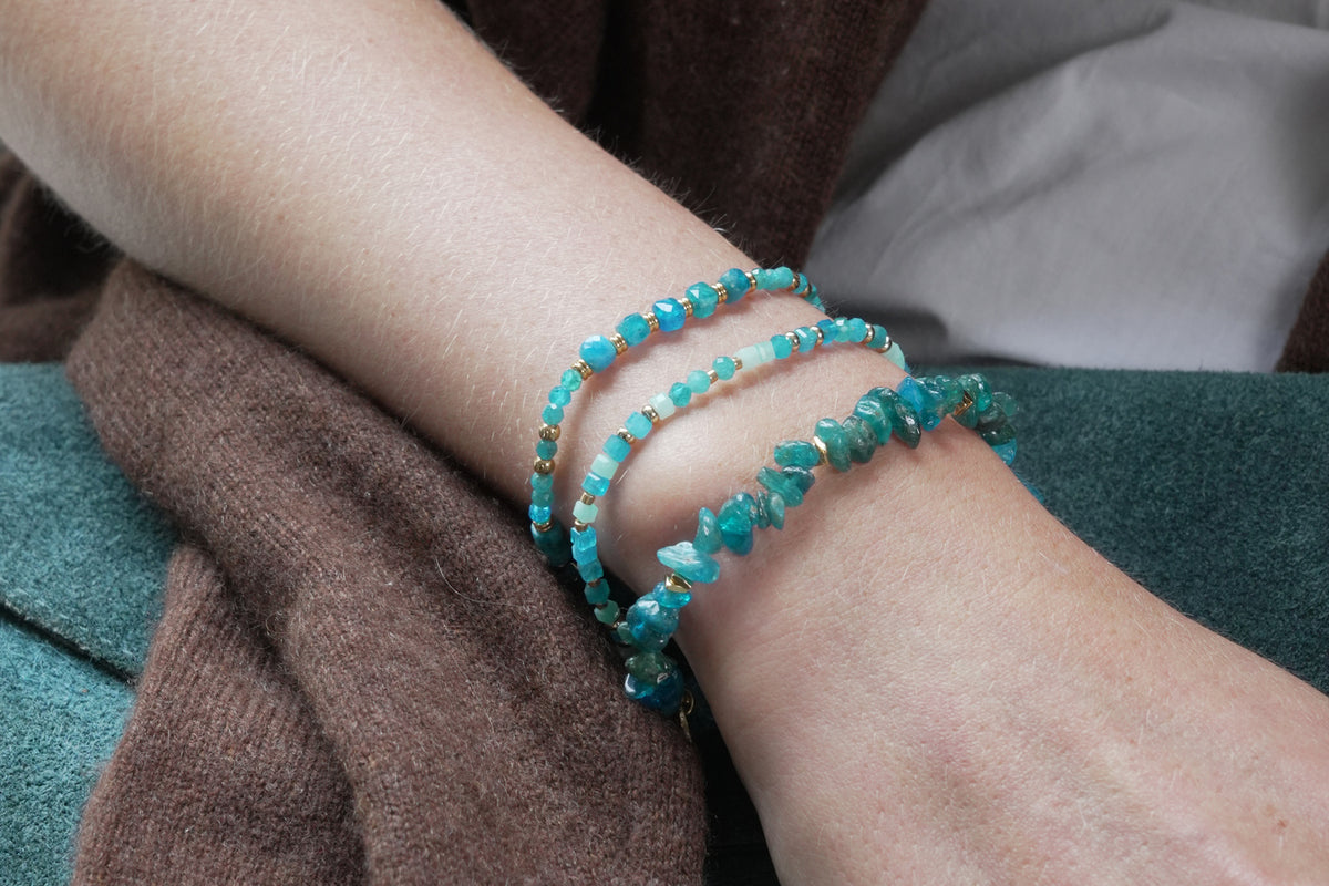 Sana apatite and gold stretch bracelet by Boho Betty – styled in a stack, a gold apatite gemstone beaded stretch bracelet