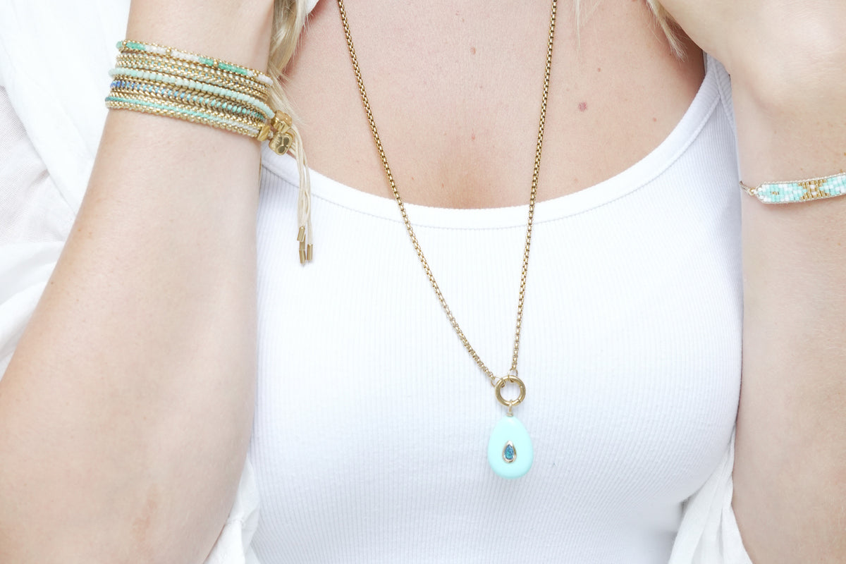 Thalia Fleur turquoise howlite gold teardrop pendant necklace by Boho Betty – layered with other jewellery