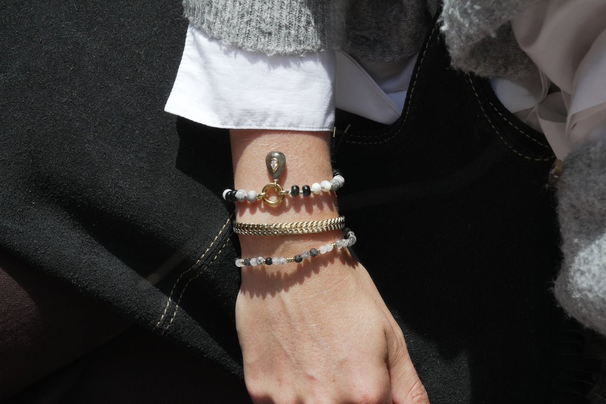 Wonder gold and black rutilated quartz bracelet by Boho Betty – a gold black rutilated quartz beaded stretch bracelet