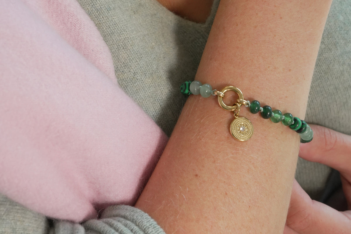 Zaha green mix and Lucia sun compass bracelet by Boho Betty – a gold green beaded sun charm carrier bracelet