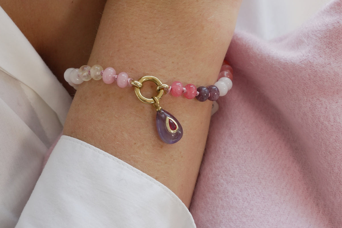 Zaha red mix and Fleurette amethyst bracelet by Boho Betty – styled in a stack, a gold amethyst beaded charm carrier bracelet