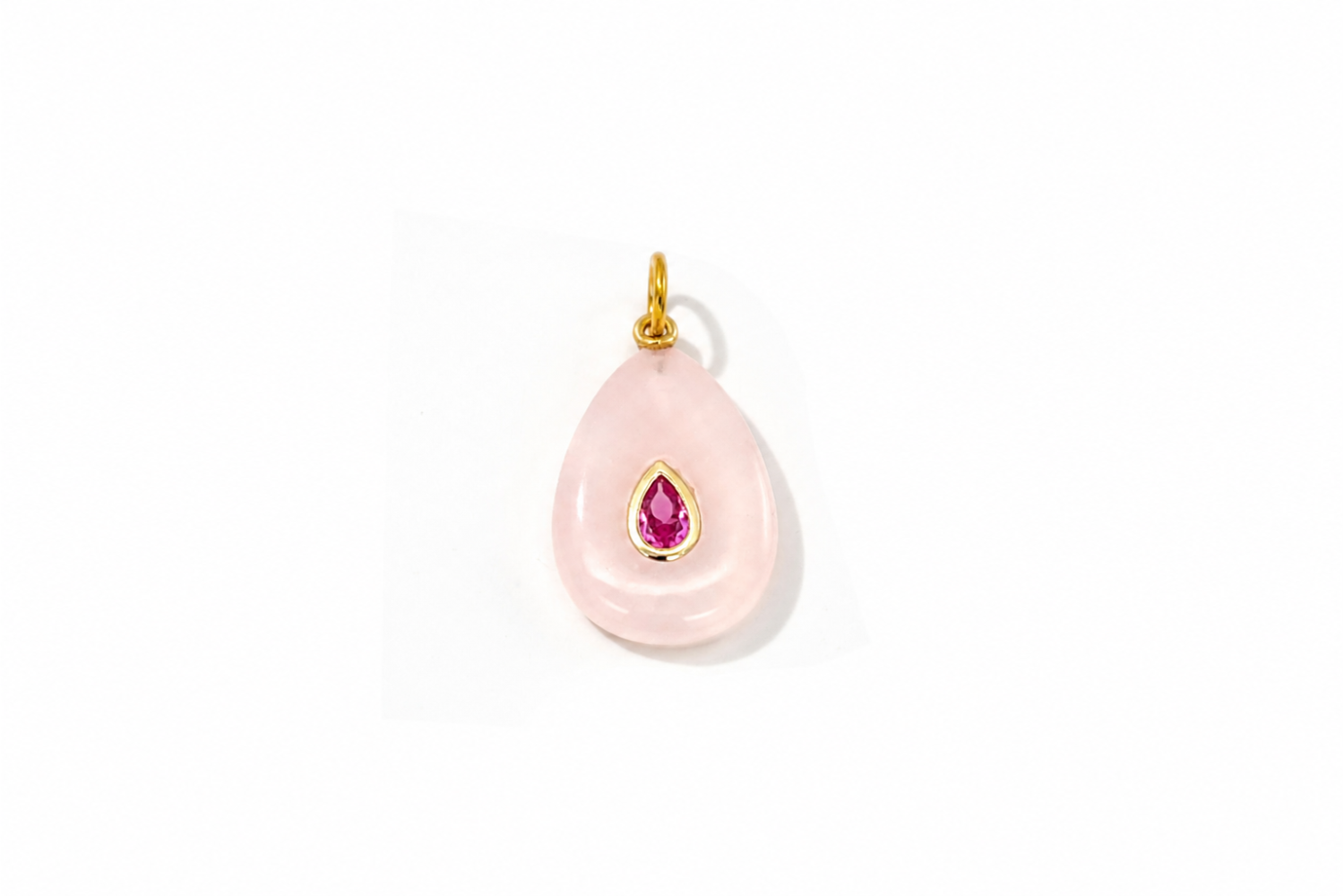 Fleur Rose Quartz Charm Gold featuring a carved rose quartz gemstone with a ruby-coloured crystal on a waterproof 14k gold PVD loop.