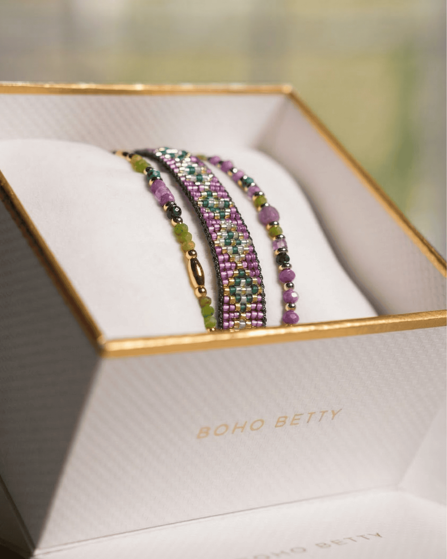 Madeira purple, green and gold beaded stacking bracelets in Boho Betty gift box, colourful friendship bracelets with gold accents for layering and everyday wear