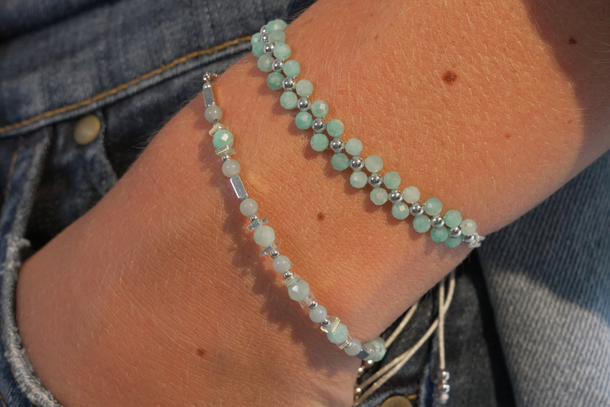 Marisol Silver & Amazonite Beaded Slider Bracelet worn in a layered wrist stack with two rows of aqua Amazonite gemstones, silver beads and white cord.