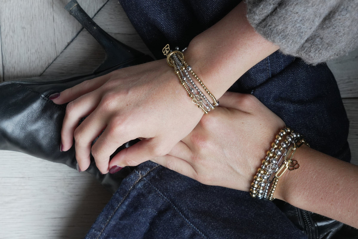 Cora gold stretch bracelet by Boho Betty – styled in a stack, a stackable gold beaded stretch bracelet for everyday wear