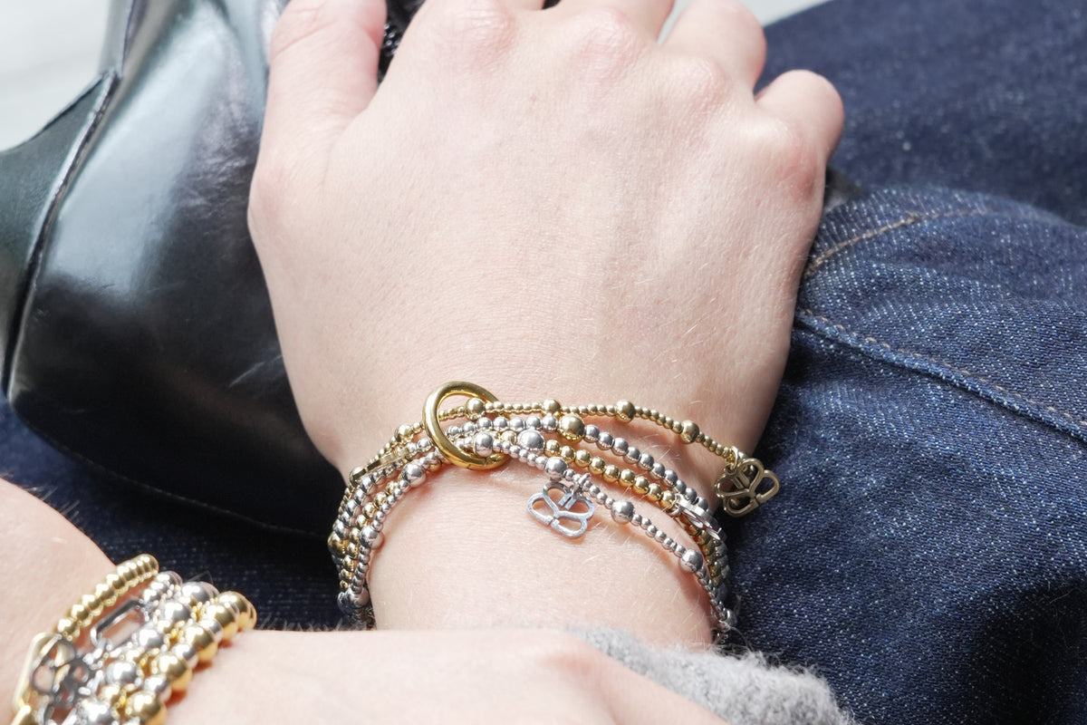 Cora silver stretch bracelet by Boho Betty – styled in a stack, a stackable silver beaded stretch bracelet for everyday wear