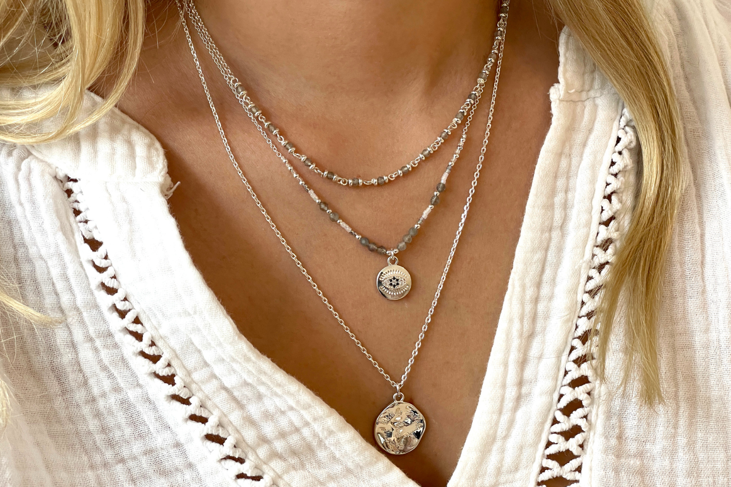 Model picture showcasing the panacea labradorite silver as the perfect layering necklace with the be you pendant necklace and Fortuna labradorite silver necklace. The perfect November Birthstone gift for her.