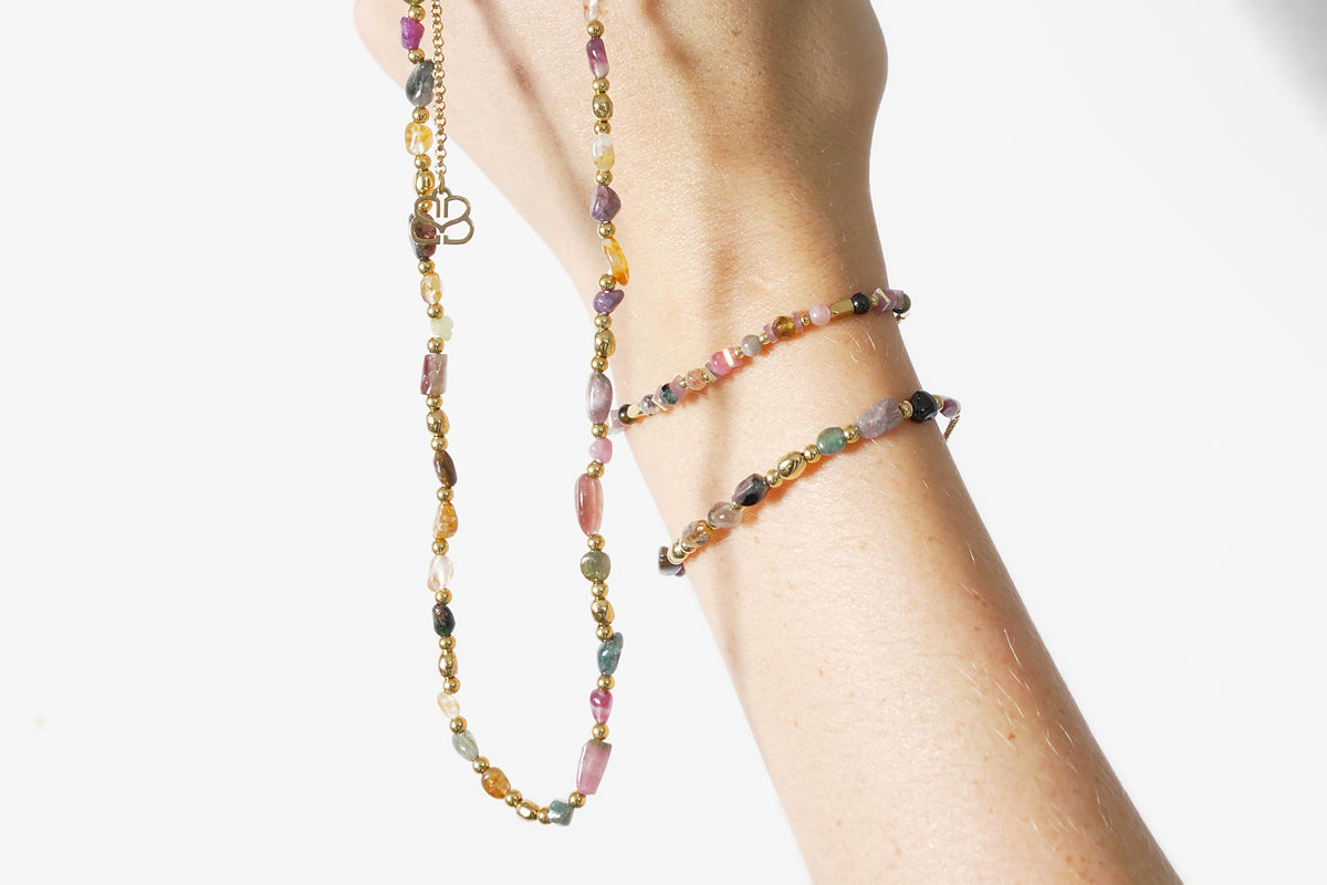 Alana gold tourmaline bead necklace by Boho Betty – styled with other jewellery, a gold tourmaline beaded slider necklace