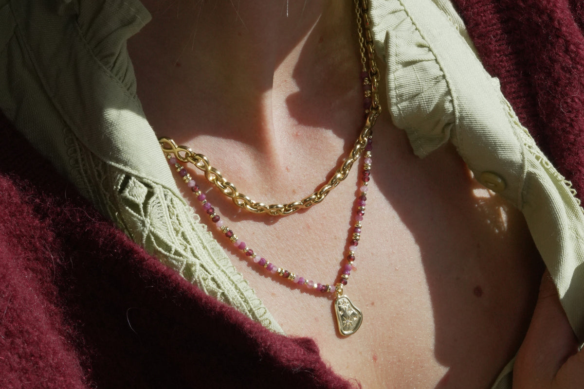 Armino ruby mix gold beaded pendant necklace by Boho Betty – styled with other jewellery, a ruby layering necklace