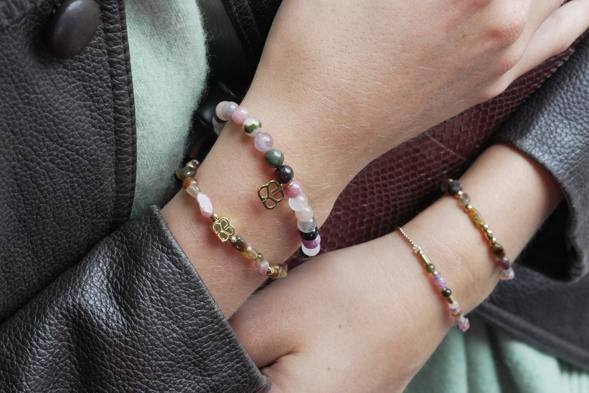 Charlene gold tourmaline gemstone bracelet by Boho Betty – styled in a stack, a gold tourmaline beaded stretch bracelet