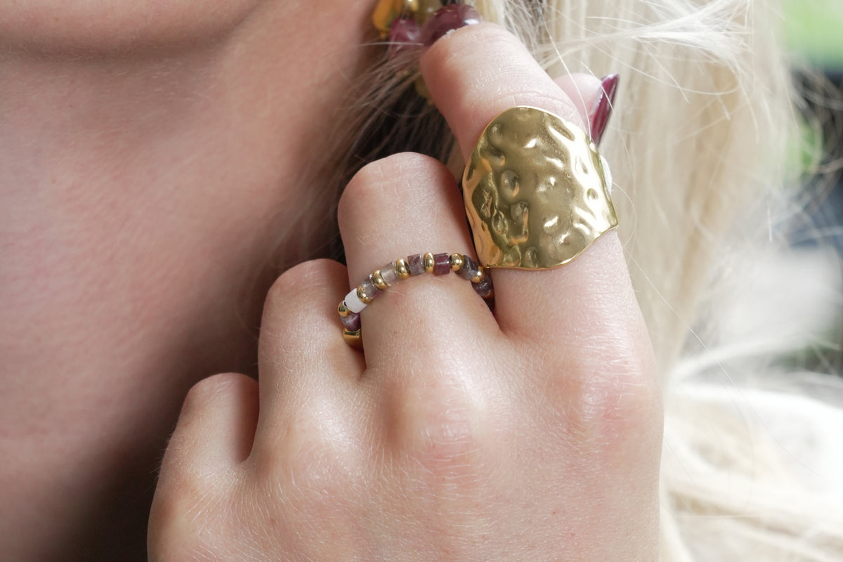 Mala tourmaline gold gemstone ring by Boho Betty – styled with other jewellery, a gold tourmaline gemstone stacking ring