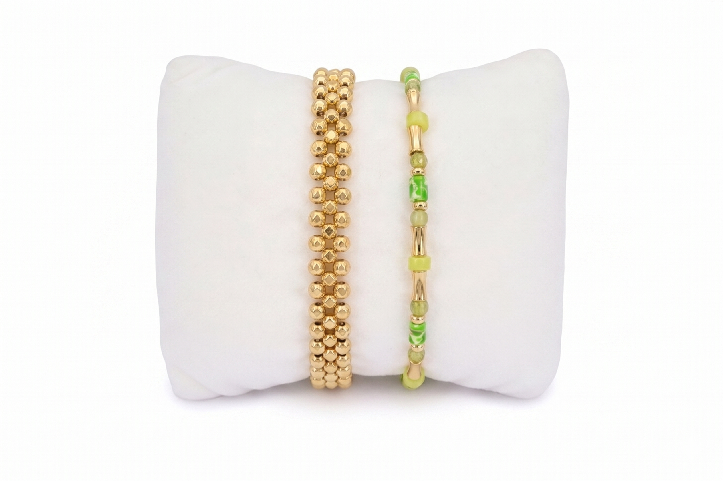 Gold beaded adjustable bracelet layered with green peirdot gold gemstone bracelet 