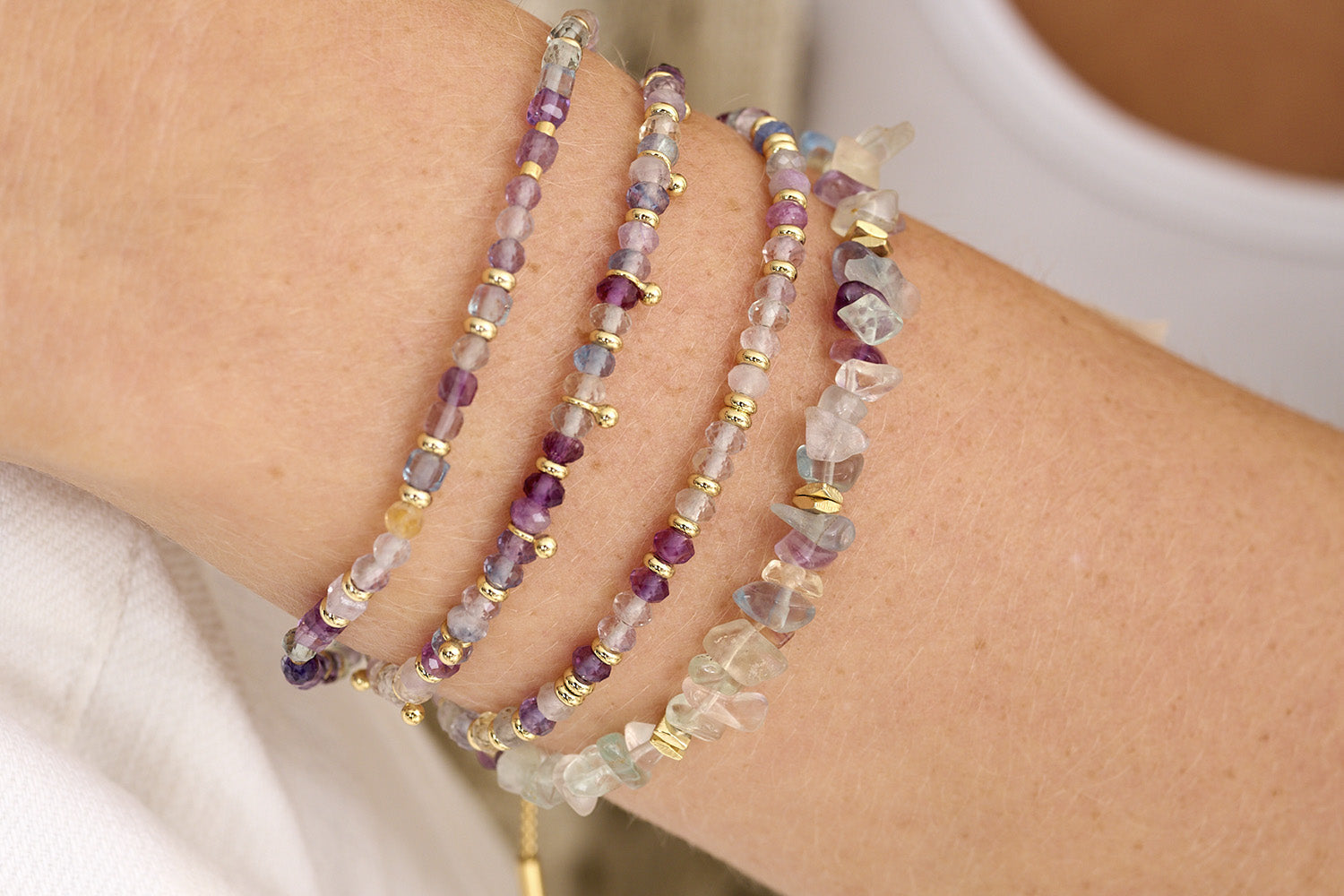 Dreamy Rainbow Fluorite Bracelets stacked high for a dreamy look.