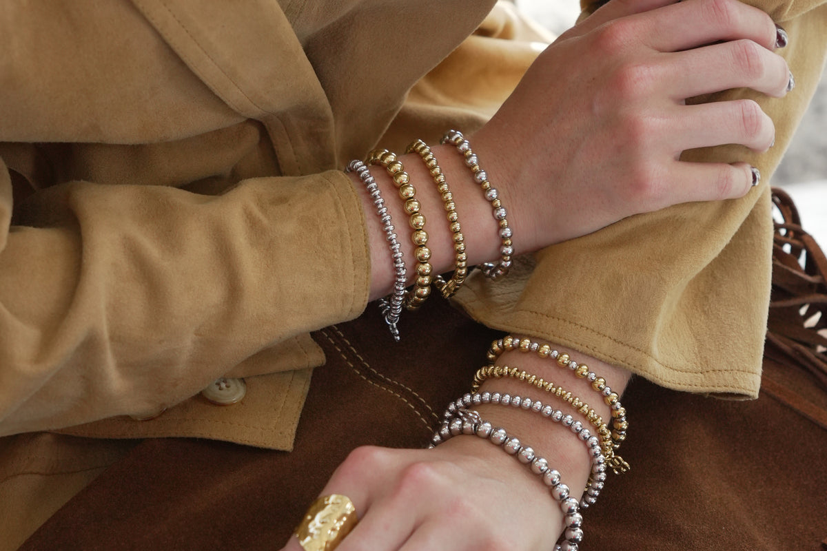 Enso silver bead stretch bracelet by Boho Betty – styled in a stack, a stackable silver beaded stretch bracelet