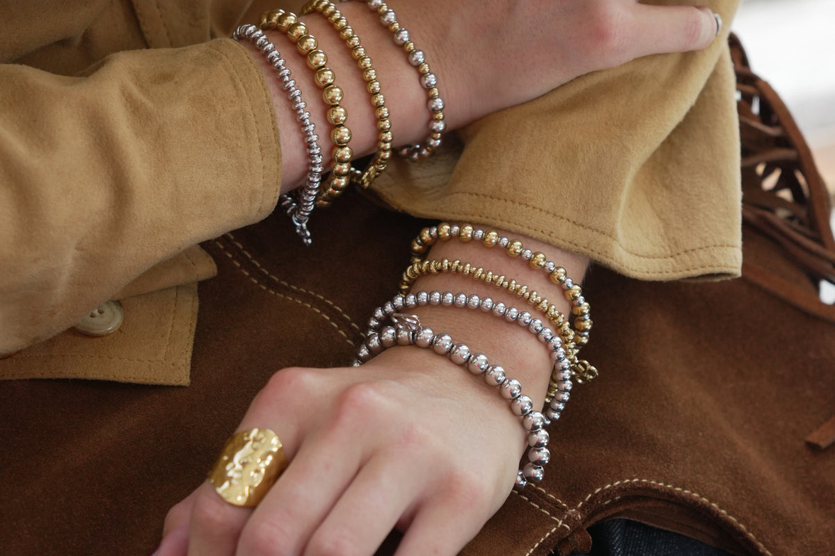 Lissette gold bead bracelet by Boho Betty – styled in a stack, a stackable gold beaded stretch bracelet for everyday wear