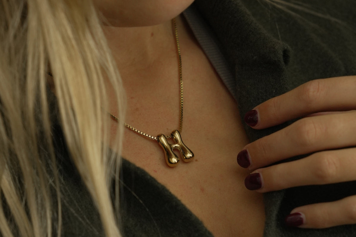 Sola waterproof gold initial letter H necklace by Boho Betty – a gold bubble letter H initial necklace on a fine box chain