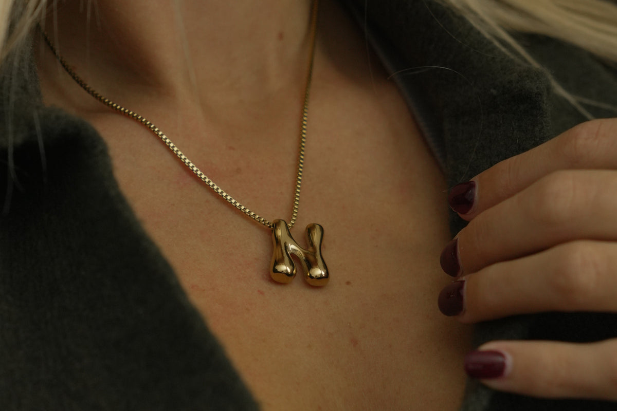 Sola waterproof gold initial letter N necklace by Boho Betty – a gold bubble letter N initial necklace on a fine box chain