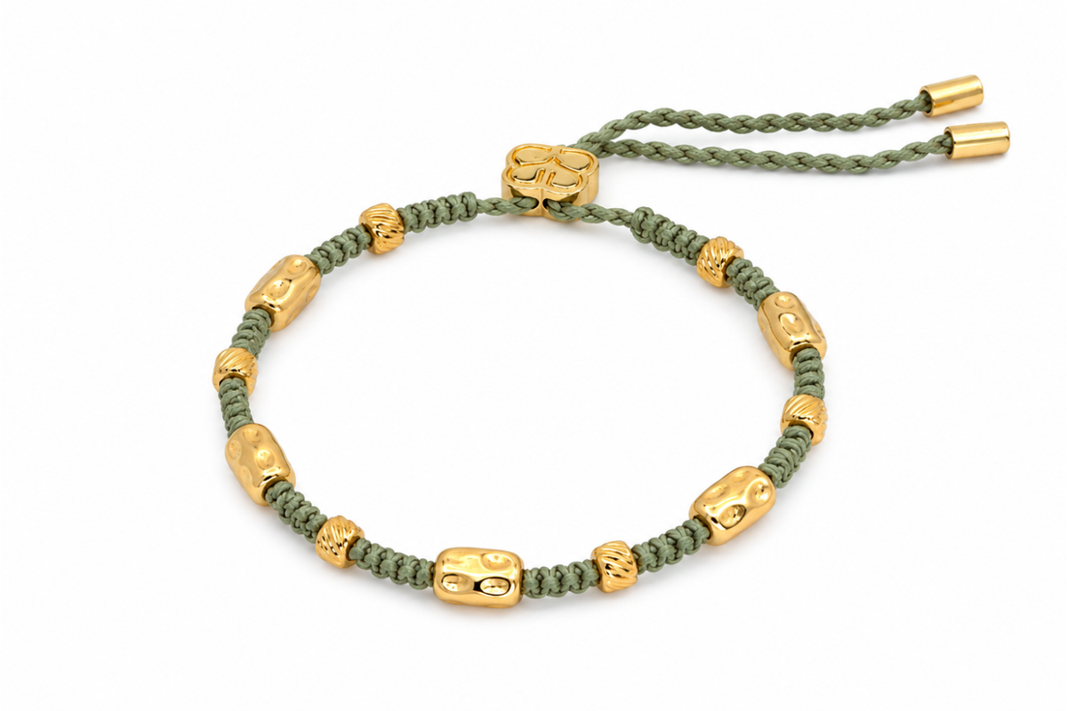 Sutra Olive Green & Gold Woven Friendship Bracelet featuring knotted olive green cord, organic gold pebble beads and waterproof 14k Gold PVD details.