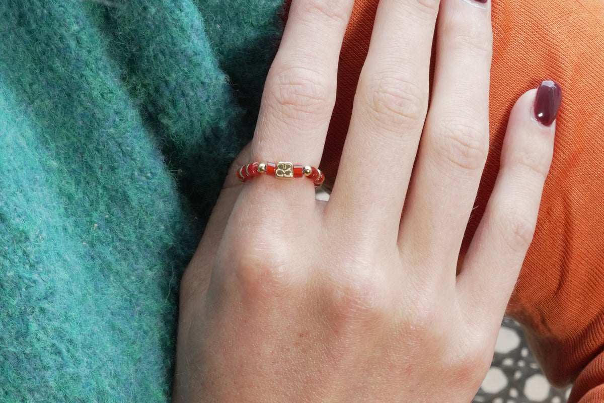 Mala red agate gold ring by Boho Betty – styled with other jewellery, a gold red agate gemstone stacking ring