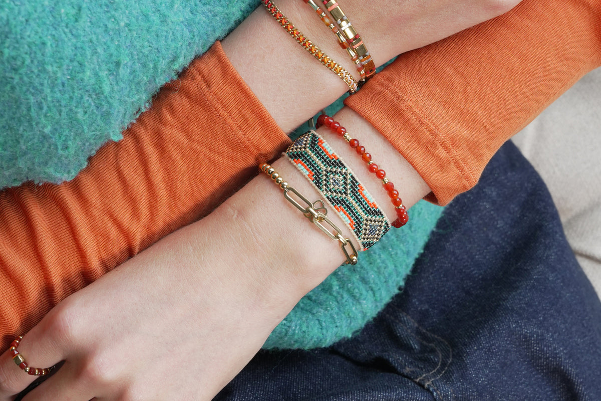 Wonder gold and orange agate gemstone bead bracelet by Boho Betty – styled in a stack, a gold orange agate stretch bracelet