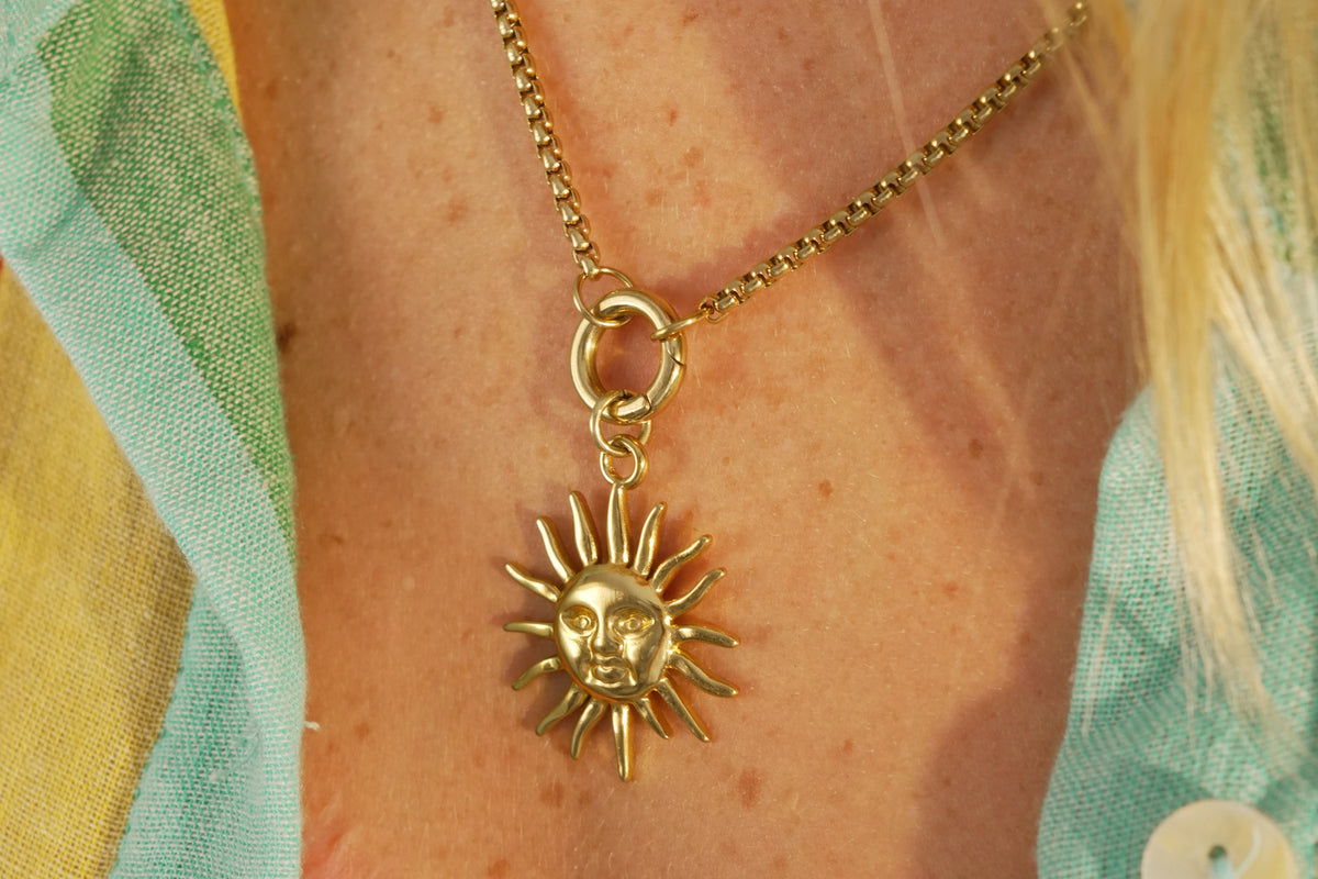Thalia gold sun pendant necklace by Boho Betty – a short gold chain with a sculptural sun pendant
