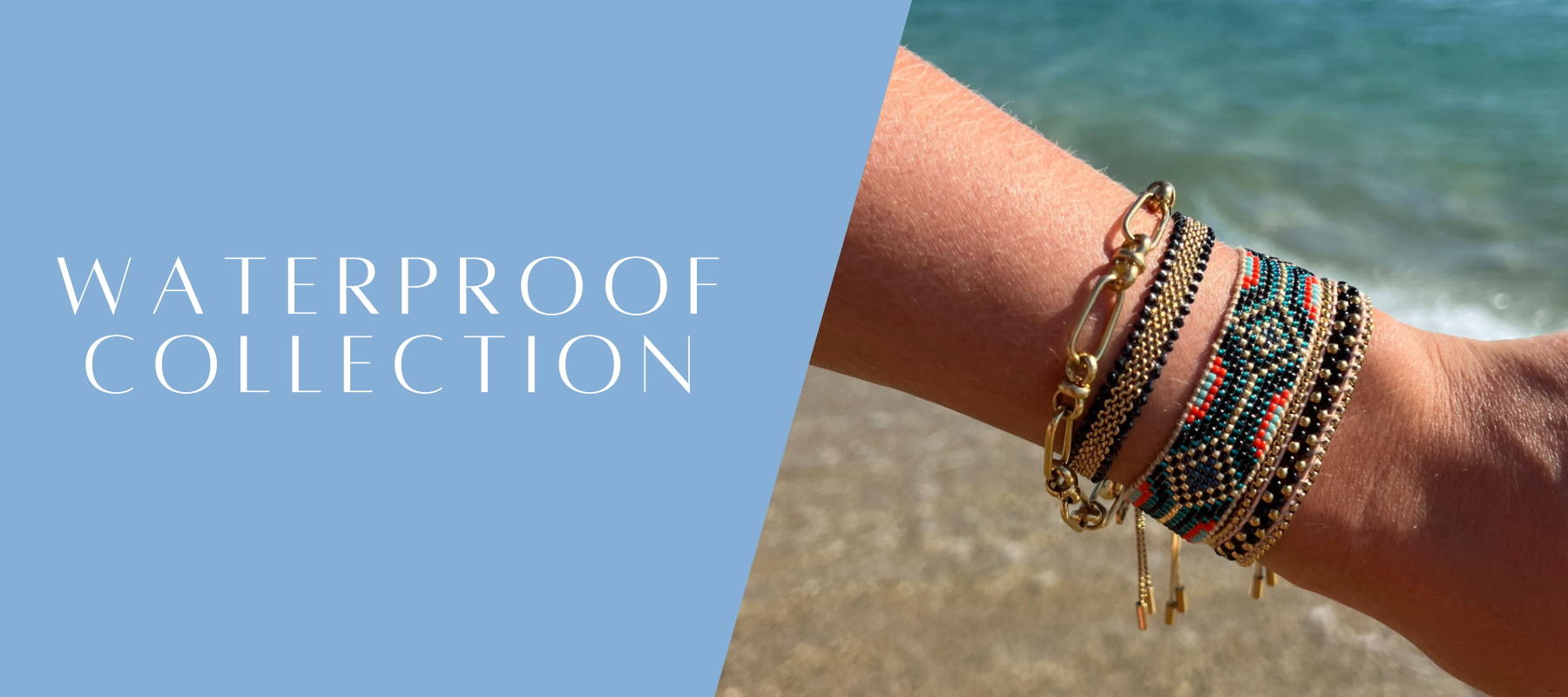 Waterproof jewellery collection banner featuring stacked gold and beaded bracelets on a wrist at the beach with ocean background.