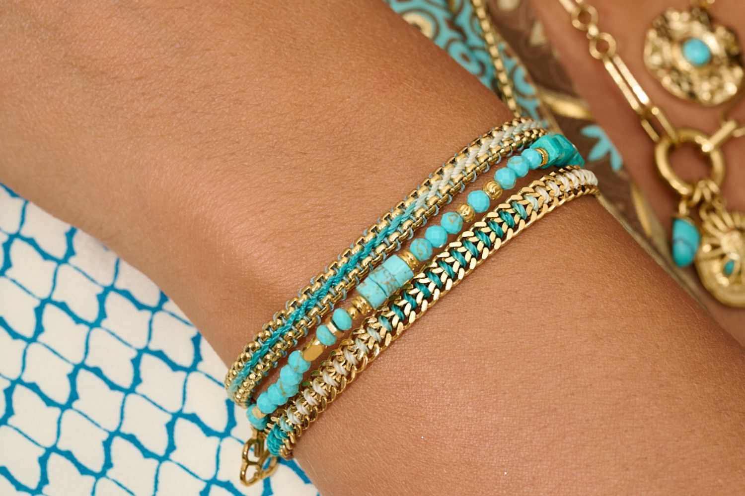 Stylish turquoise braided and beaded bracelets with gold accents. Stunning vibrant colours and a new addition to the Boho Betty waterproof collection.