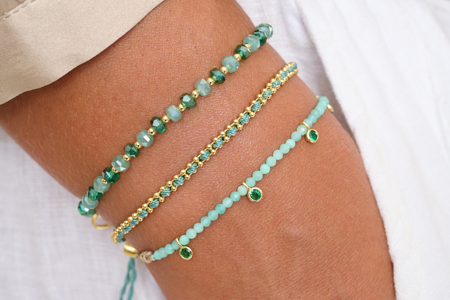 Aitutaki Amazonite & Gold Stacking Bracelet styled with relaxed summer fashion, showcasing layers of aqua tones and shimmering gold details.