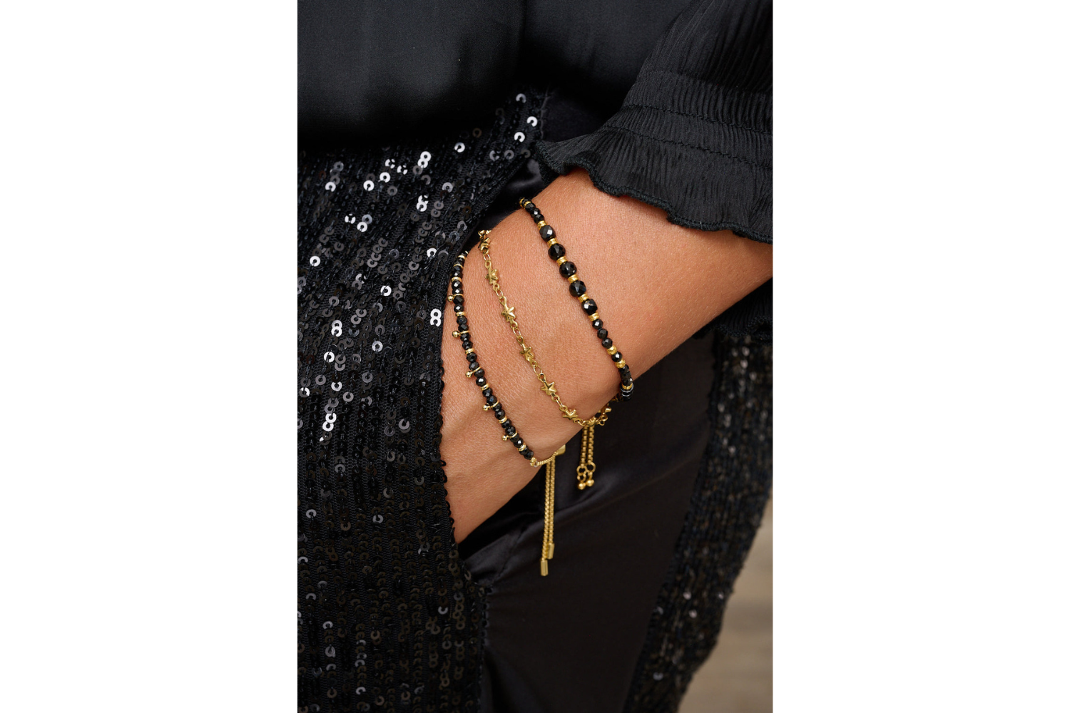 Bracelet styled on wrist with starry gold Boho Betty stacking bracelets